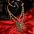 A handcrafted bridal necklace featuring Polki, Kundan, and ruby accents in royal Indian design.